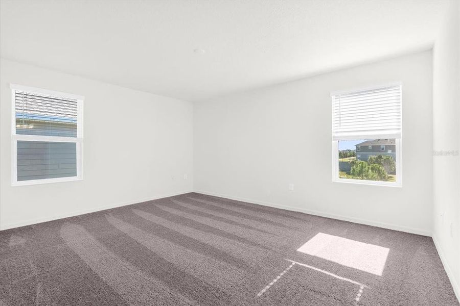 Spacious, unfurnished interior of a new home in Bellaviva III at Westside, Davenport (Image 17).