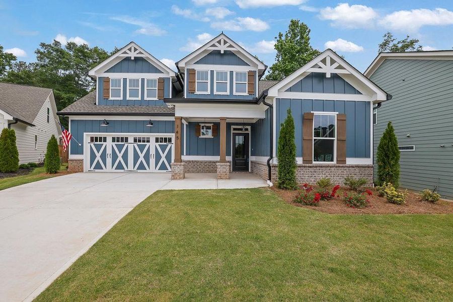 Front exterior of a new home in , Holly Springs, GA, highlighting curb appeal (Image 2). Front exterior of a new home in , Holly Springs, GA, highlighting curb appeal (Image 2).