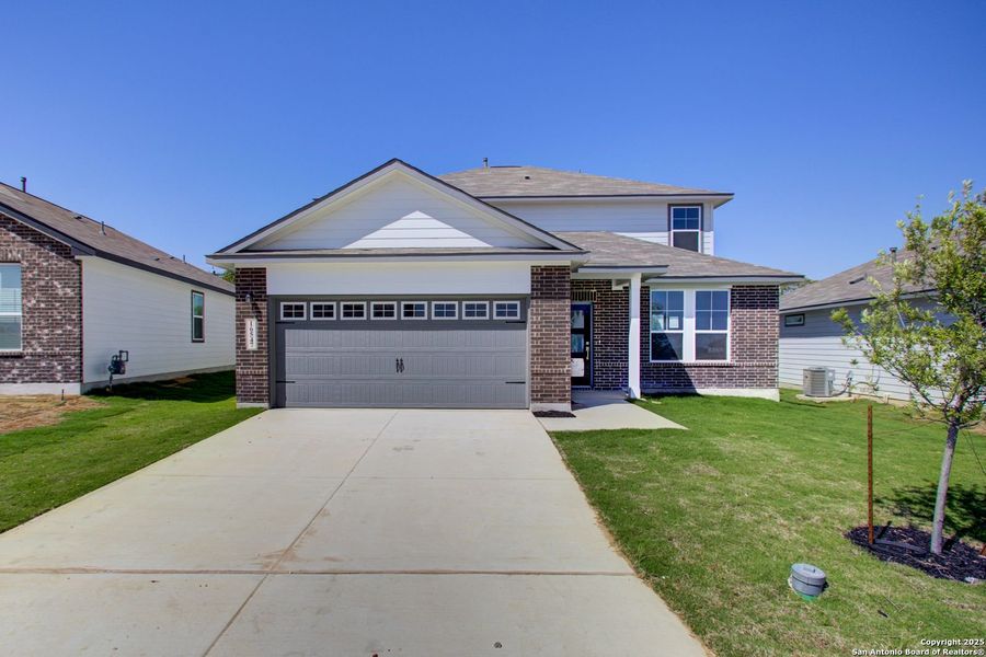 Front exterior of a new home in Hickory Ridge, San Antonio, TX, highlighting curb appeal (Image 39).