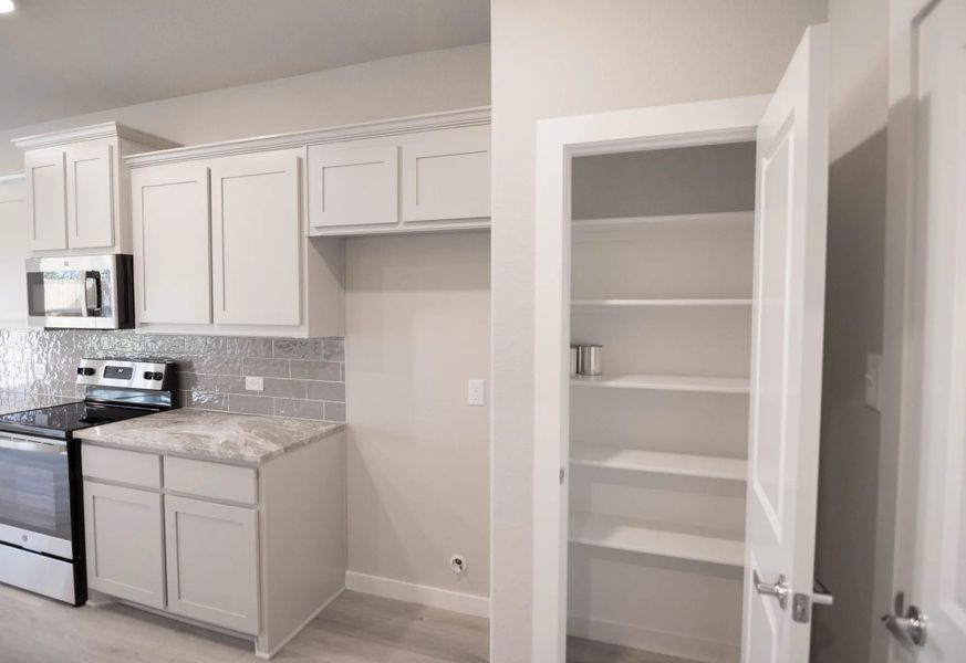 Representative furnished interior of a home built from the Hudson by Stonehollow Homes in Heritage Grove, Blue Ridge (Image 4).