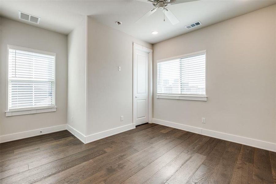 Secondary bedroom with hardwood floors  and ceiling fan