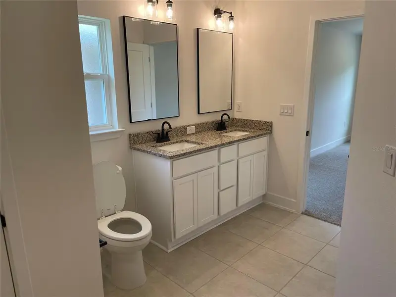 Furnished interior view inside a new home in Harmony Central, St. Cloud (Image 5).