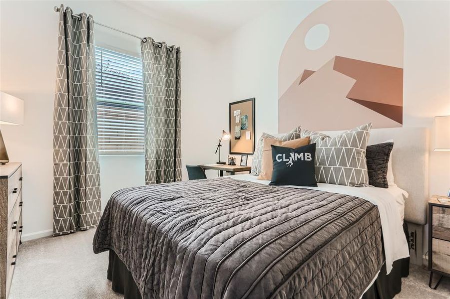 Bedroom featuring light carpet