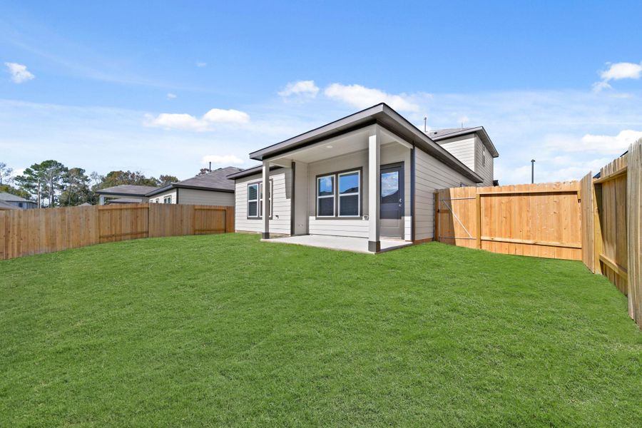 Exterior details and patio area of a home in Lexington Heights, Willis (Image 3). Exterior details and patio area of a home in Lexington Heights, Willis (Image 3).