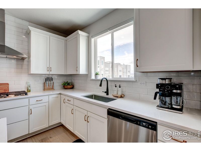 Full tile backsplash, large stainless sink and Mountain Views from the kitchen!