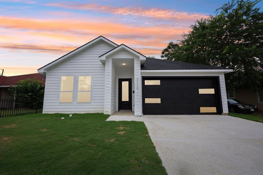 View of front of property with an attached garage and driveway View of front of property with an attached garage and driveway