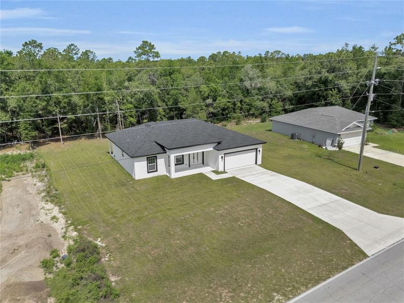 Front exterior of a new home in , Citrus Springs, FL, highlighting curb appeal (Image 18).