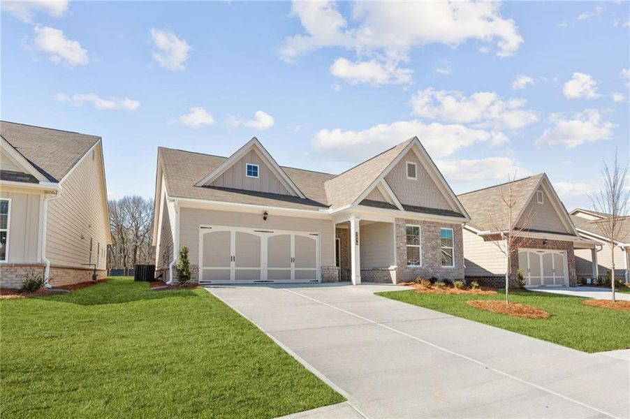 Front exterior of a new home in Cooper's Walk, Loganville, GA, highlighting curb appeal (Image 18).