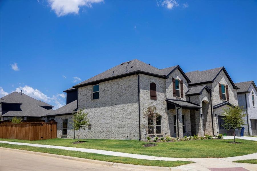 Front exterior of a new home in , Little Elm, TX, highlighting curb appeal (Image 24).