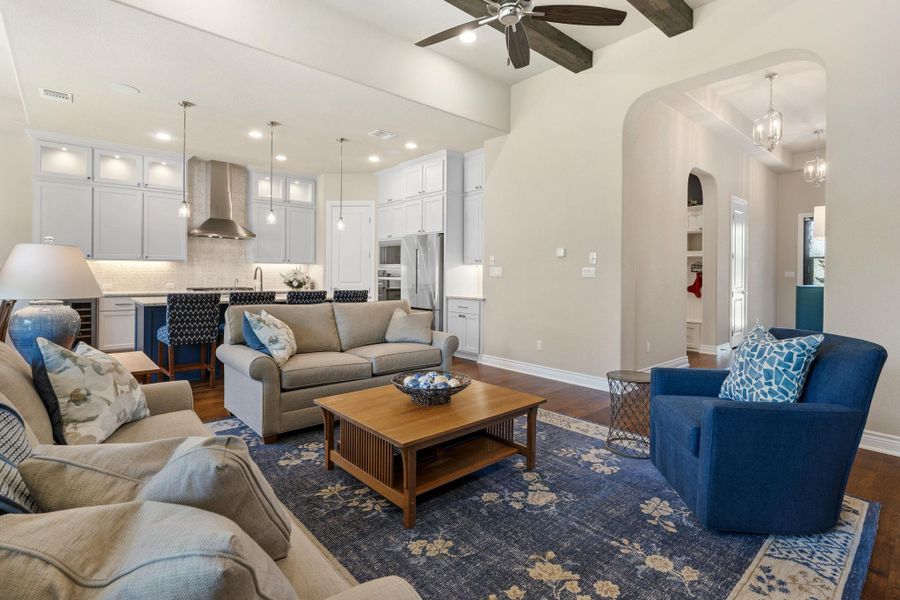 Rich wood flooring adds warmth and continuity throughout the main living areas. Rich wood flooring adds warmth and continuity throughout the main living areas.