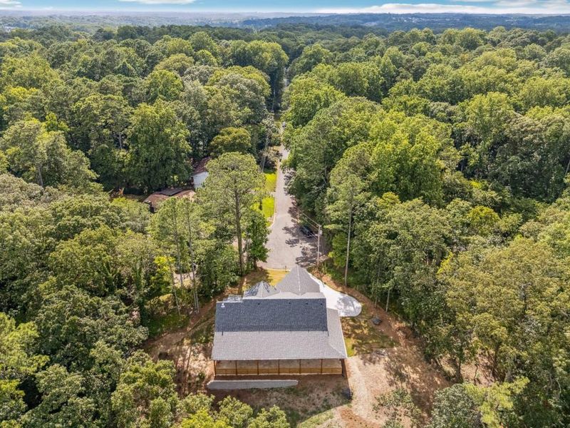 Front exterior of a new home in , Woodstock, GA, highlighting curb appeal (Image 26).