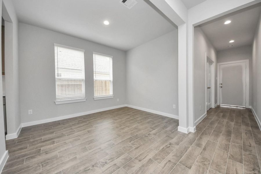 Craft enduring memories with loved ones around the table! This roomy diningarea boasts stylish flooring, personalized paint, and is conveniently situated nextto the family room and kitchen, fostering an open and inclusive ambiance.