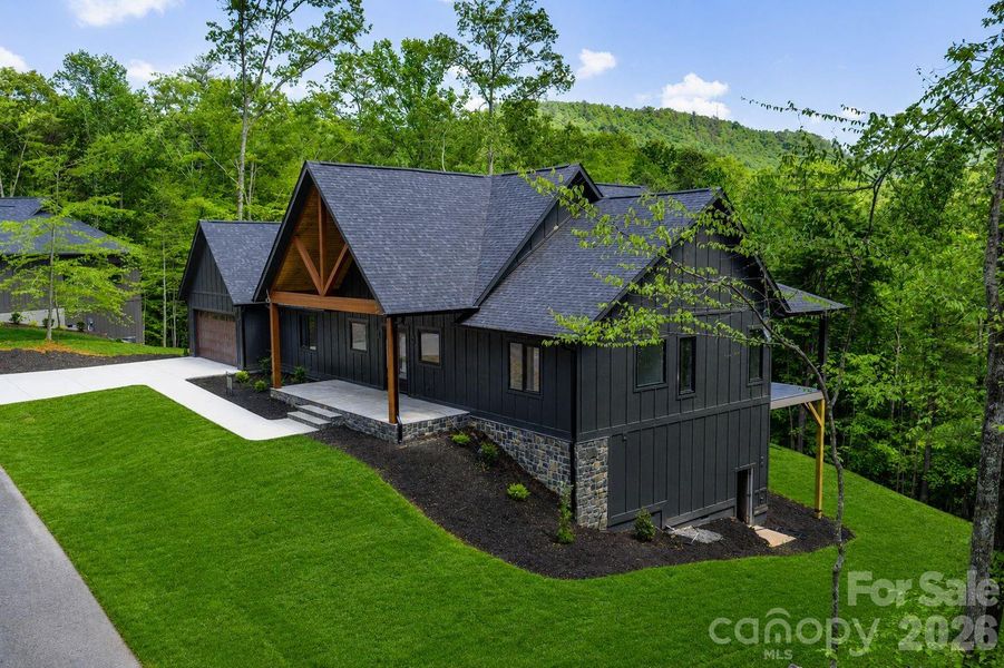 Front exterior of a new home in , Hendersonville, NC, highlighting curb appeal (Image 6).