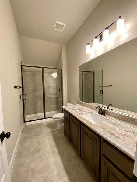 Bath 3 upstairs with walk-in shower, granite counters, and 12x24 tile