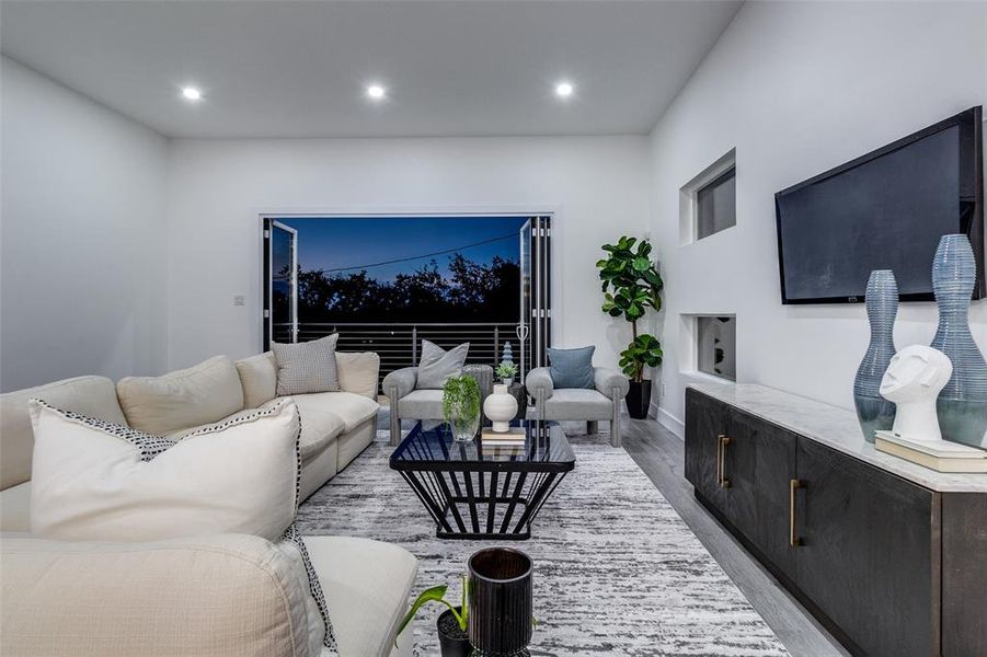 Living room with light wood-type flooring