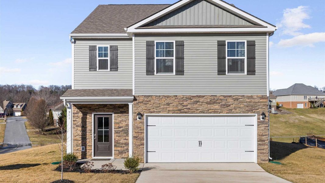 Front exterior of a new home in Keebler Meadows, Johnson City, TN, highlighting curb appeal (Image 2). Front exterior of a new home in Keebler Meadows, Johnson City, TN, highlighting curb appeal (Image 2).