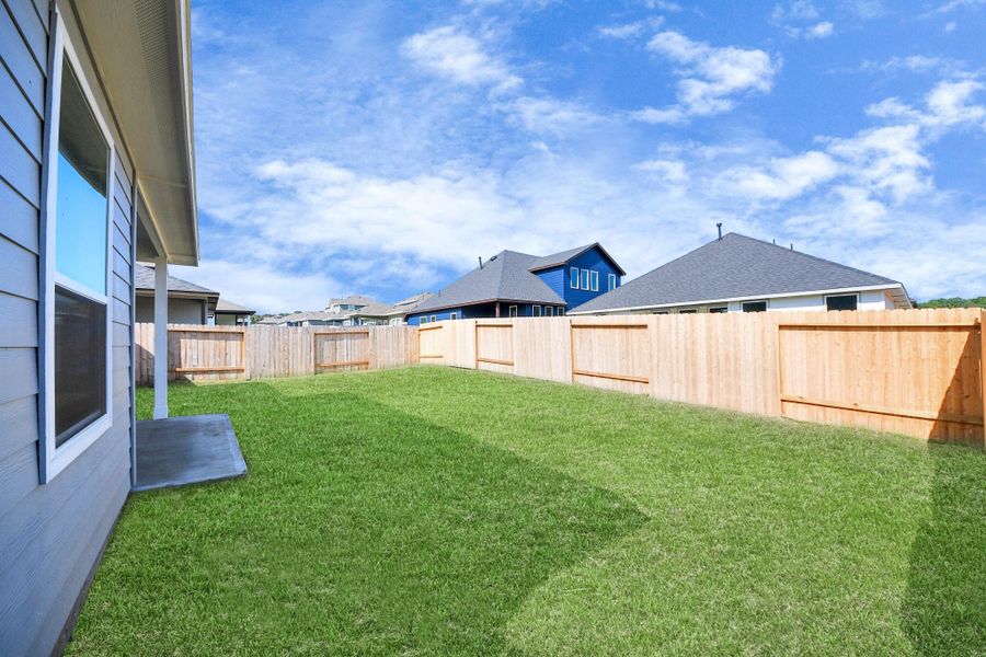 Exterior details and patio area of a home in Lexington Heights, Willis (Image 26).