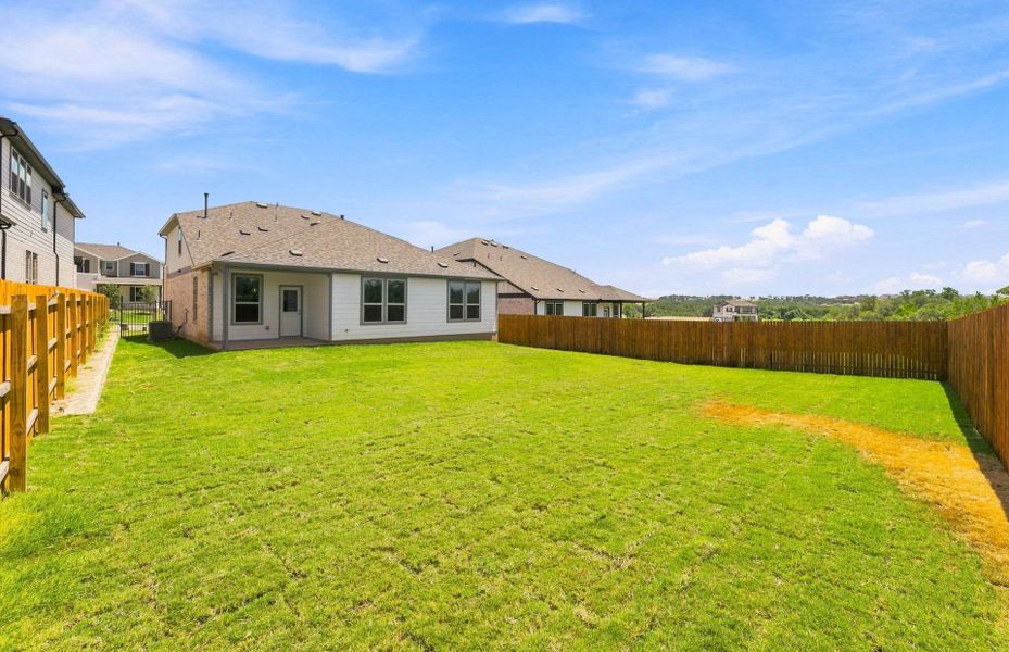 Exterior details and patio area of a home in Saddleback at Santa Rita Ranch, Liberty Hill (Image 30).