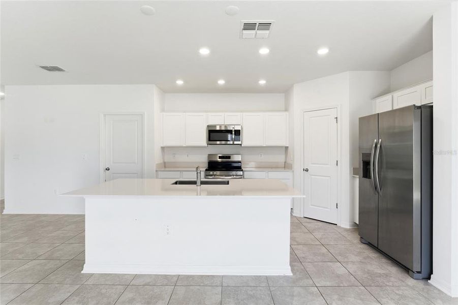 Furnished interior view inside a new home in , Winter Haven (Image 8). Furnished interior view inside a new home in , Winter Haven (Image 8).