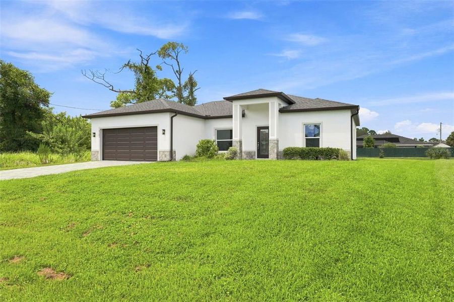 Front exterior of a new home in , North Port, FL, highlighting curb appeal (Image 16).