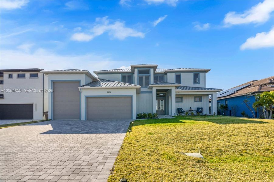 Front exterior of a new home in , Cape Coral, FL, highlighting curb appeal (Image 24).