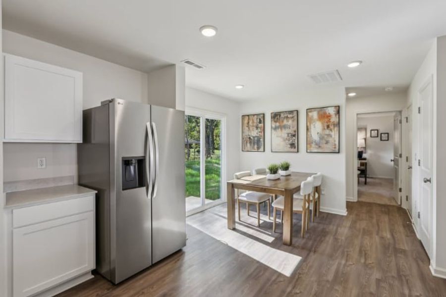 A kitchen with a dining table. A kitchen with a dining table.