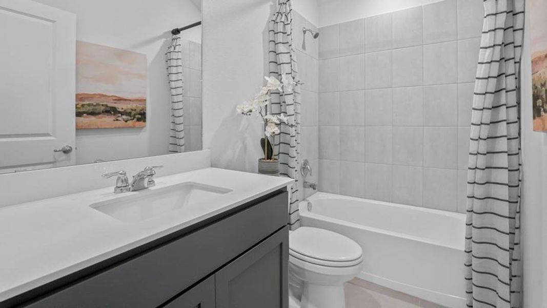 Full bath with shower / bath combo and vanity