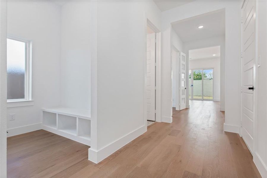 Hallway featuring light hardwood / wood-style flooring