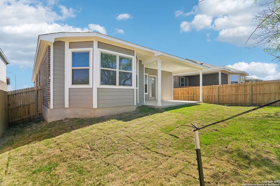 Front exterior of a new home in Comanche Ridge, San Antonio, TX, highlighting curb appeal (Image 2). Front exterior of a new home in Comanche Ridge, San Antonio, TX, highlighting curb appeal (Image 2).