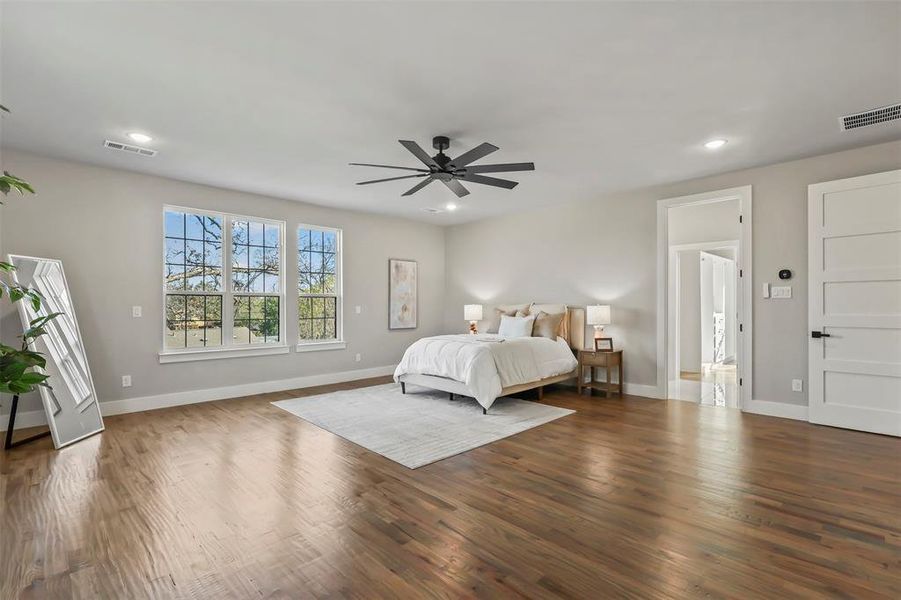 Bedroom featuring wood finished floors, recessed lighting, and ceiling fan Bedroom featuring wood finished floors, recessed lighting, and ceiling fan
