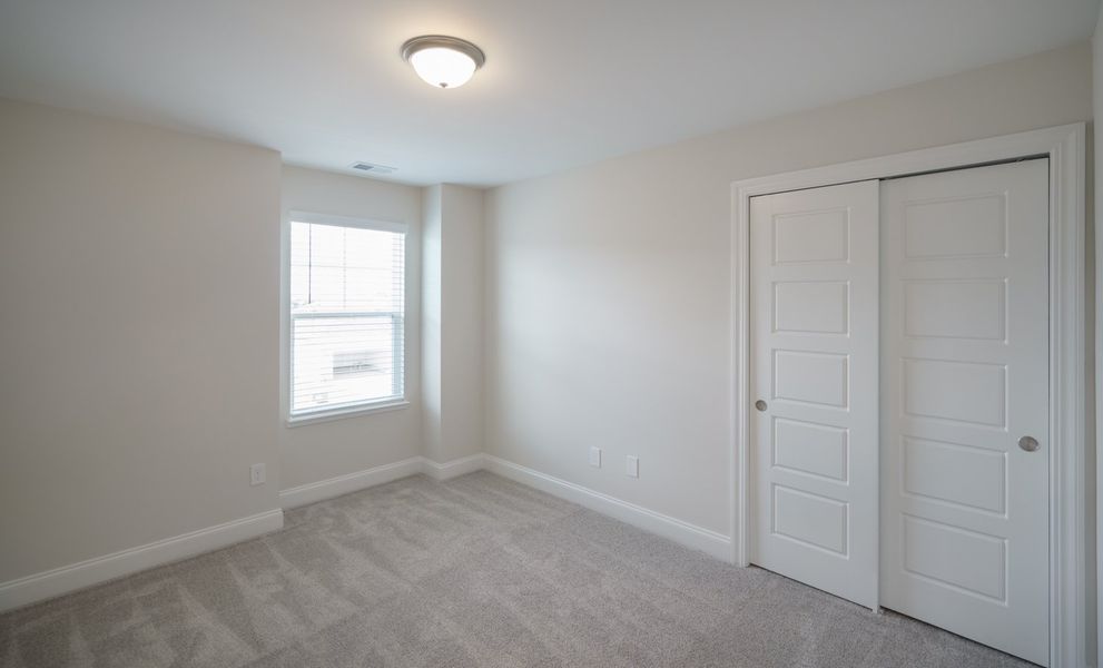 Representative unfurnished interior of a home built from the The McKee by Cothran Homes in Holly Ridge, Greenville (Image 42). Representative unfurnished interior of a home built from the The McKee by Cothran Homes in Holly Ridge, Greenville (Image 42).