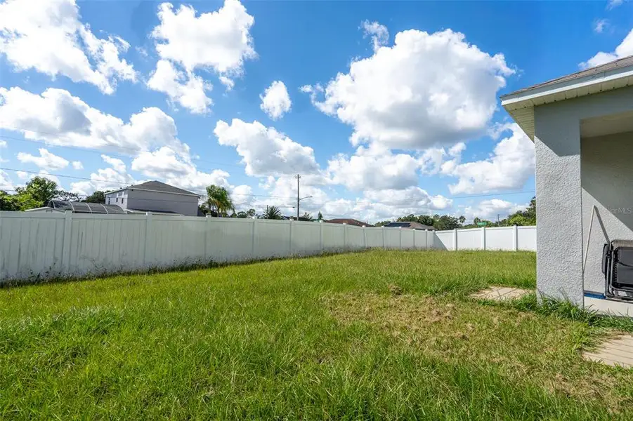 Exterior details and patio area of a home in Poinciana Enclave, Kissimmee (Image 3).