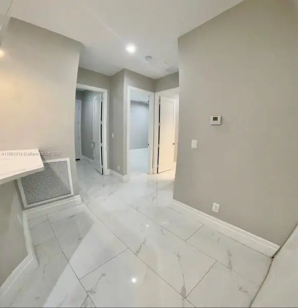 hall to bedrooms, laundry & garage