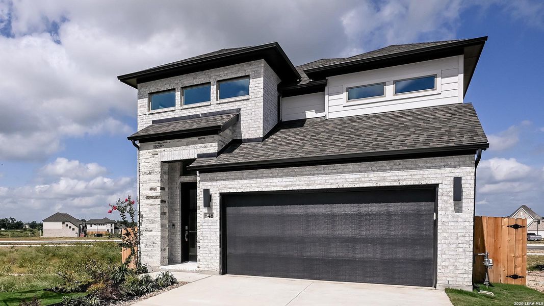 Front exterior of a new home in Legacy at Lake Dunlap, New Braunfels, TX, highlighting curb appeal (Image 24). Front exterior of a new home in Legacy at Lake Dunlap, New Braunfels, TX, highlighting curb appeal (Image 24).
