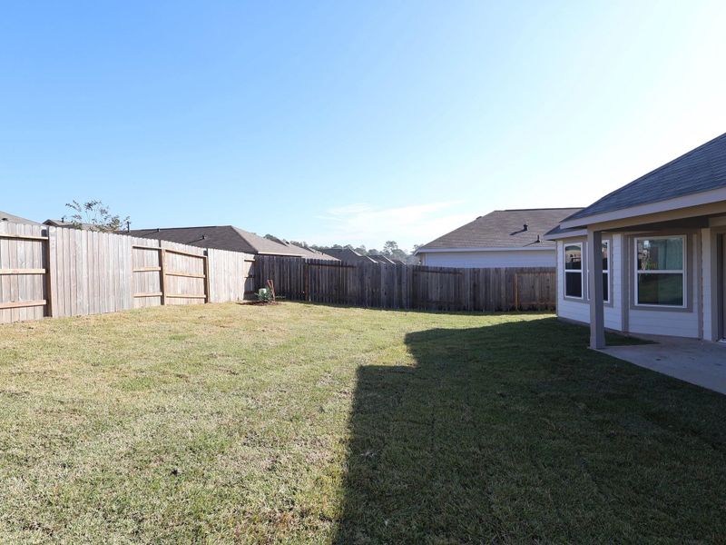 Exterior details and patio area of a home in Magnolia Ridge, Magnolia (Image 21).