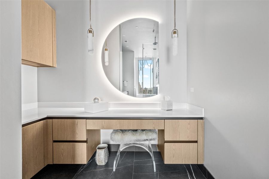 Primary designed vanity area featuring a custom LED mirror and sophisticated luxury lighting.