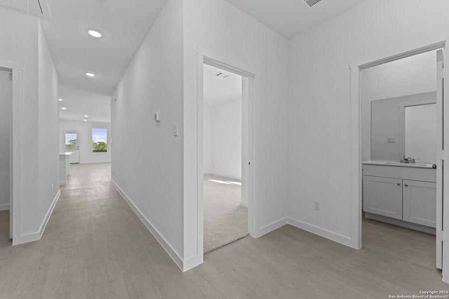 Spacious, unfurnished interior of a new home in Waterwheel: Coastline Collection, San Antonio (Image 18).
