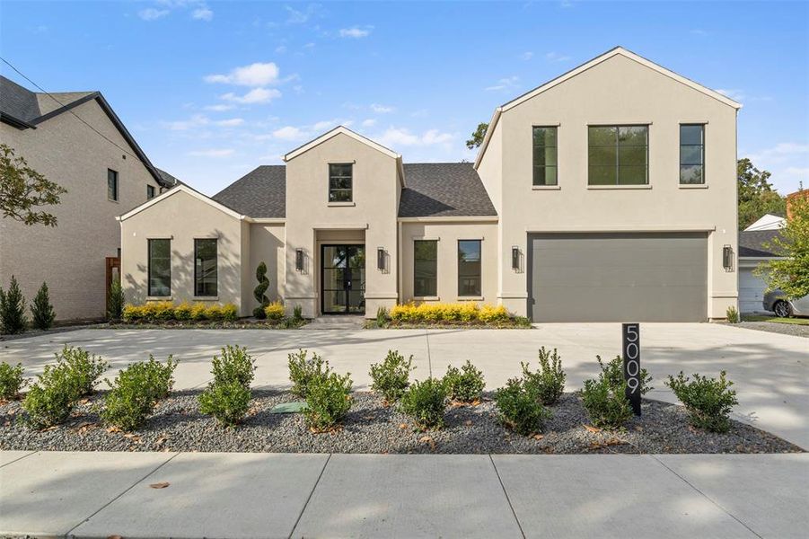View of front of property with stucco siding, driveway, a garage, and a shingled roof View of front of property with stucco siding, driveway, a garage, and a shingled roof