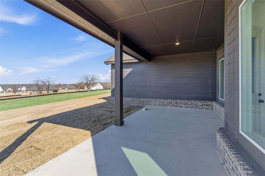 Exterior details and patio area of a home in Oak Grove Addition, Springtown (Image 4).
