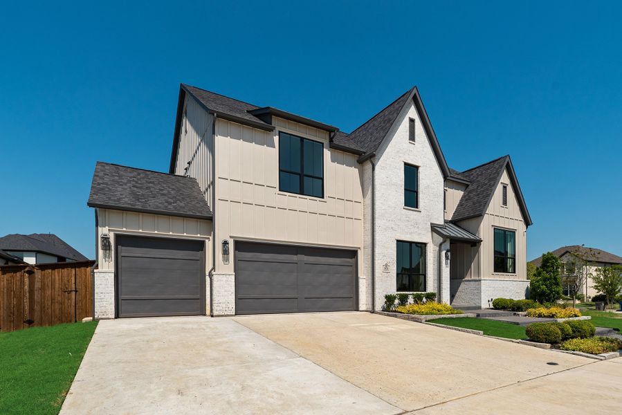 Front exterior of a new home in Light Farms Graham/Reagan, Celina, TX, highlighting curb appeal (Image 23).