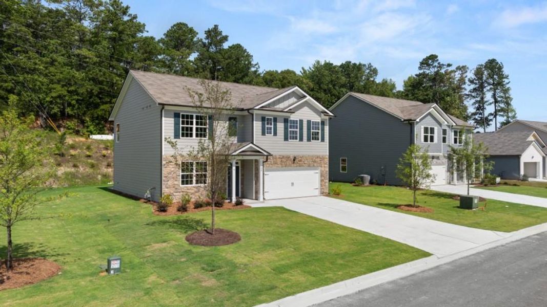 Front exterior of a new home in Northwoods at Mirror Lake, Villa Rica, GA, highlighting curb appeal (Image 20).