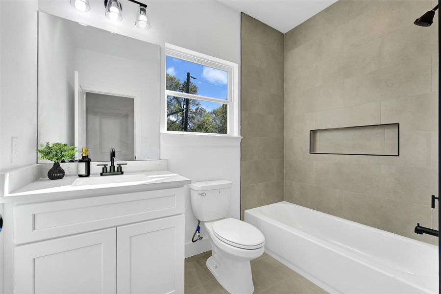 Full bath with contemporary design and quality finishes.
