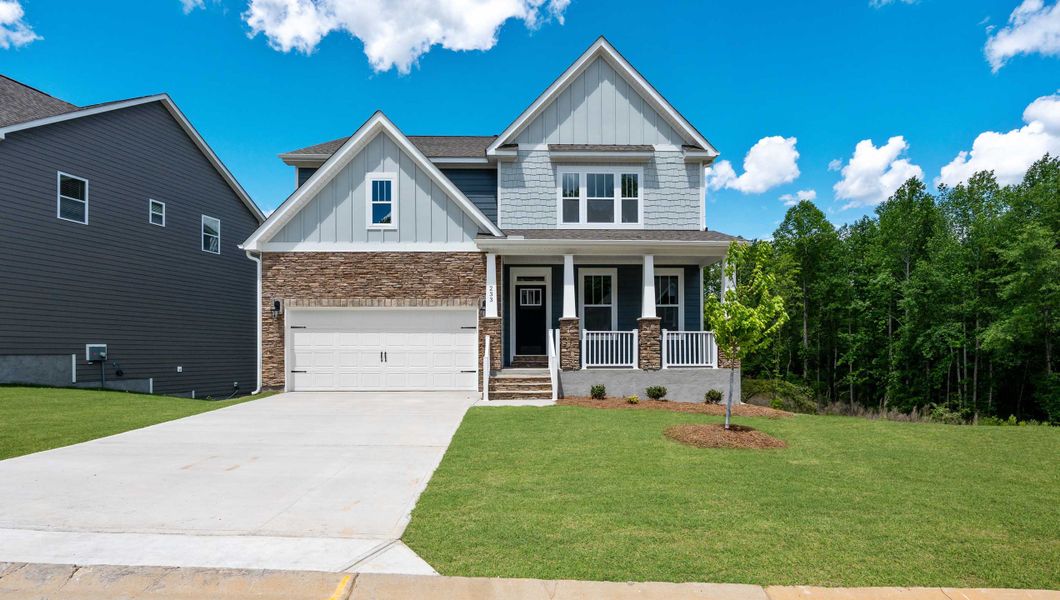Front exterior of a new home in Whitehawk Meadows, Travelers Rest, SC, highlighting curb appeal (Image 1). Front exterior of a new home in Whitehawk Meadows, Travelers Rest, SC, highlighting curb appeal (Image 1).