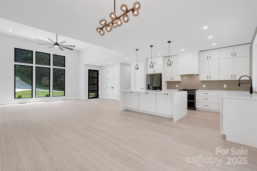 dining area and kitchen looking at the front entrance dining area and kitchen looking at the front entrance
