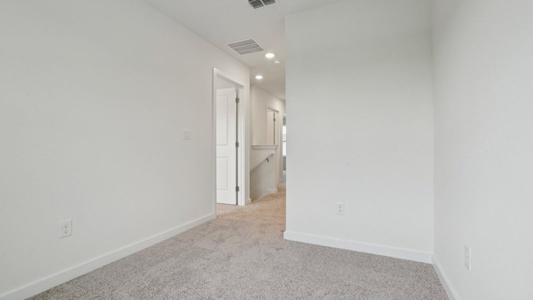 Upstairs Hallway of the Coronado - End at Cyrene at Harmony located in St Cloud FL by DRB Homes Upstairs Hallway of the Coronado - End at Cyrene at Harmony located in St Cloud FL by DRB Homes