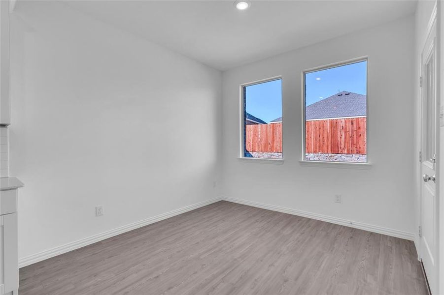 Unfurnished room with light hardwood / wood-style floors