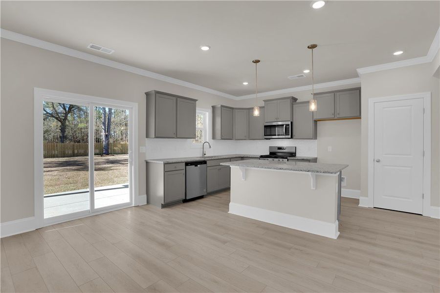 This bright kitchen features sleek appliances, amp This bright kitchen features sleek appliances, amp