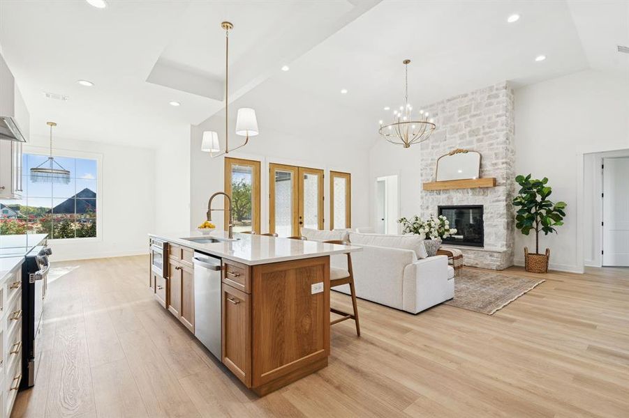 Another view with a shot of the stunning light fixture in the dining room.