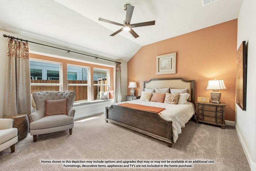 Bedroom with vaulted ceiling, ceiling fan, carpet, and large windows with an accent wall painted orange Bedroom with vaulted ceiling, ceiling fan, carpet, and large windows with an accent wall painted orange
