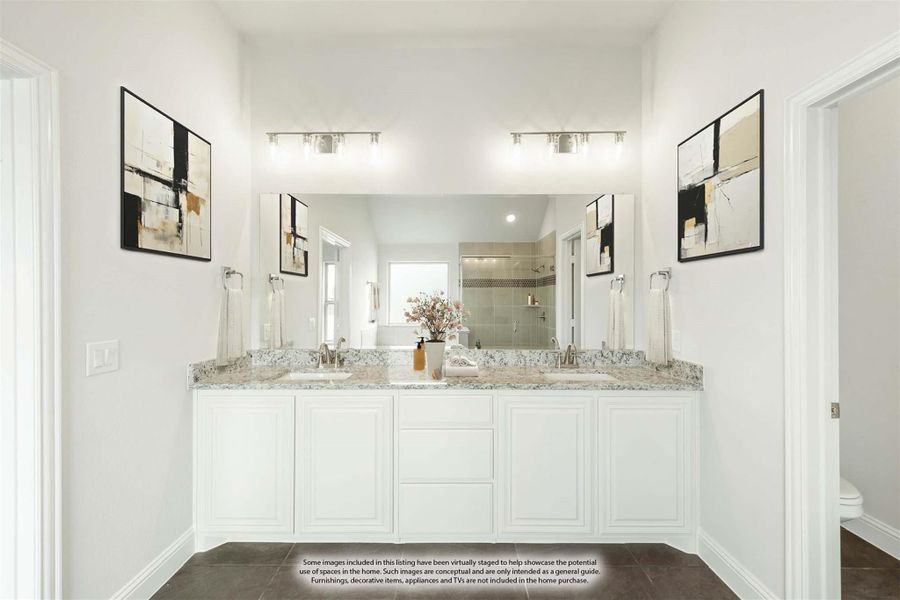 Bathroom with double vanity, white cabinets, granite countertops, and large mirror with overhead lighting Bathroom with double vanity, white cabinets, granite countertops, and large mirror with overhead lighting